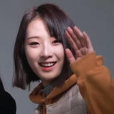 haseul from loona waving at the camera, click for about & dfi